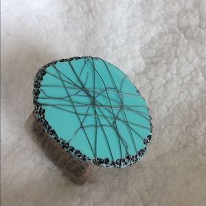Turquoise and silver toned statement cuff bracelet